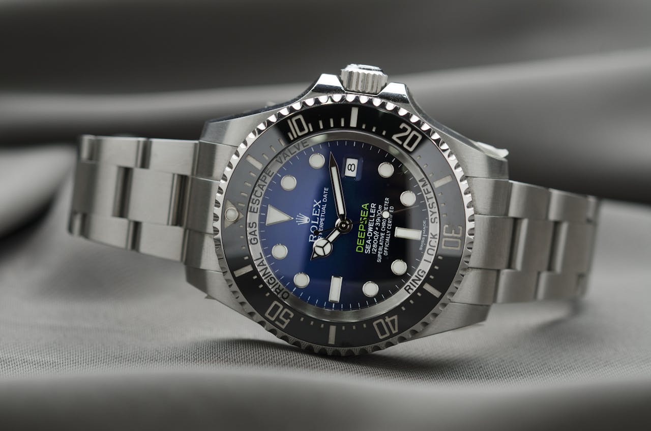 hero-img-02 High-end Rolex wristwatch showcasing precision engineering and luxury design.